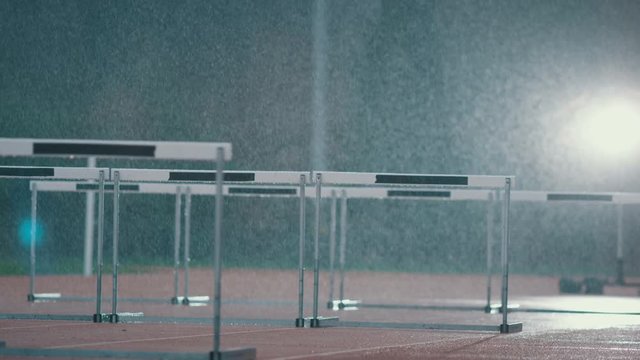  Professional Athletics Track With Hurdles In The Rain. No People.