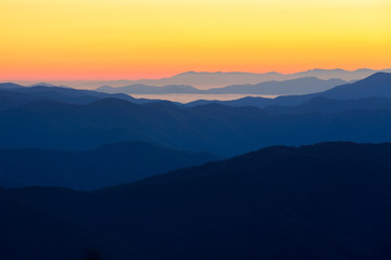 The sun rises over the blue mountains of Great Smoky Mountains National Park