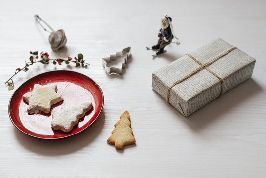 Christmas Cookies And Present On The White Table