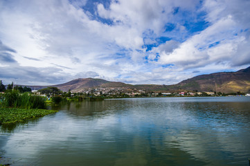 Beautiful view of the lake in Yahuarcocha, in a gorgeous cloudy day with the mountain behind in Yahuarcocha Ecuador