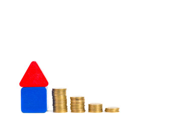 Model house wood form with step of coins stack isolated on white background, real estate investment...