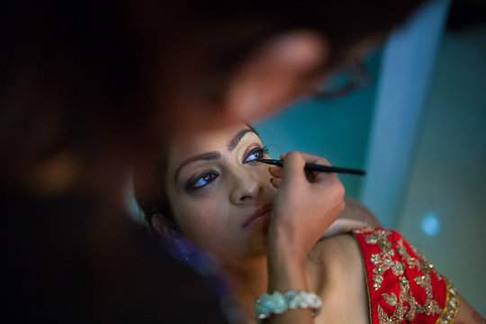 Beautiful young woman getting ready for marriage ceremony at the parlour