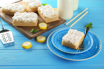 Composition with tasty banana cake on color wooden background