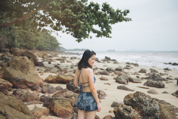Portrait of beautiful asian woman's body in sexy bikini over beach background. Asian female tourist on koh Jum,Krabi,Thailand.