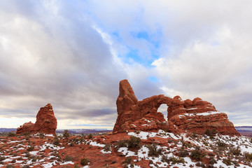The storm clouds dissipate over Turret Arch in Arches National Park, Utah © Zak Zeinert