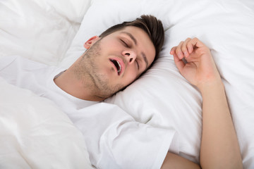Tired Young Man Snoring