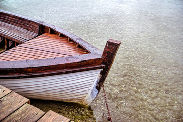 Old Working Wooden Skiff Boat Moored in Shallow Water