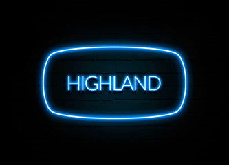 Highland  - colorful Neon Sign on brickwall