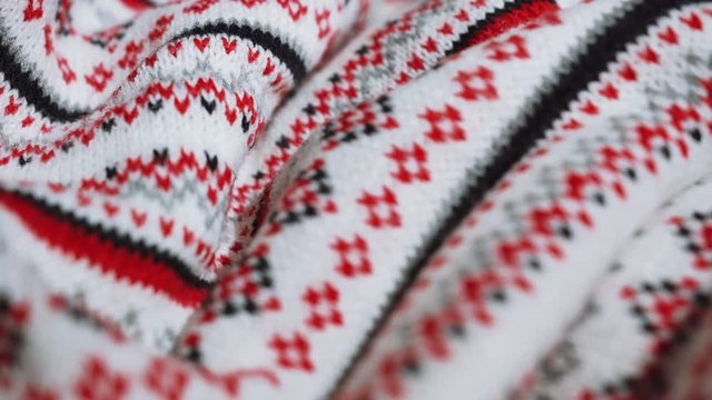 Cloth with national ornaments. New Year's and Christmas texture. use as background. close-up waves