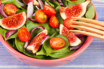 Fresh fruit and vegetable salad with wooden fork, healthy lifestyle and nutrition concept