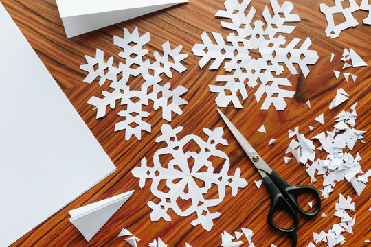 Making paper snowflake crafts.