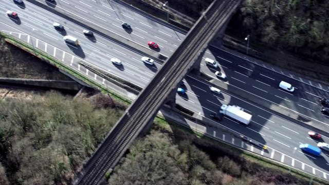 Aerial view of traffic driving on a motorway through the English countryside