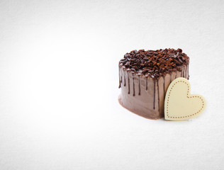 cake or love shaped chocolate cake on a background.