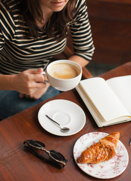 Closeup of casual businesswoman working in a terrace of coffee shop.