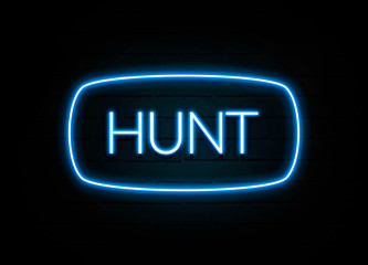 Hunt  - colorful Neon Sign on brickwall