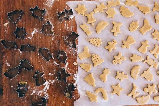 Christmas background of biscuits and cookie cutters