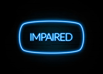 Impaired  - colorful Neon Sign on brickwall