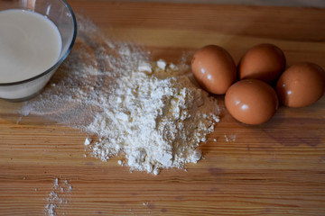 Baking ingredients on kitchen table. Lifestyle food concept.