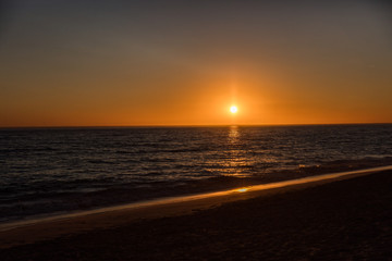 Obraz premium Watching the sunset, alone