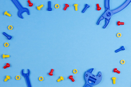 Kids Toys Top View. Colorful Toy Tools on Blue Background