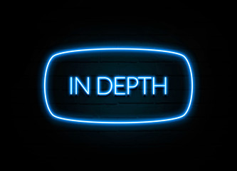 In Depth  - colorful Neon Sign on brickwall