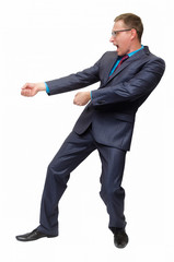 Business man in suit and glasses stands like he pulls on itself a rope isolated on white background.