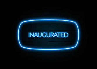 Inaugurated  - colorful Neon Sign on brickwall