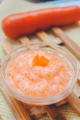 Baby food ( carrot ) close up onwooden background  table