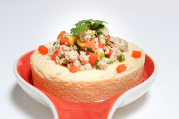 Steamed eggs with pork , tomato , corn , and Vegetable in dish on white blackground (Thai name is Kai thoon). Chicken egg menu.
