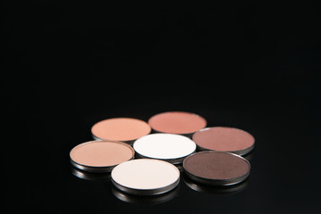 Professional nude make up set of cosmetics, top view free space. Strobing and contouring, eyeshadow beauty concept