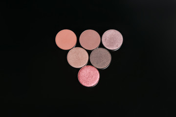 Professional make up set of cosmetics, close up top view. Shimmering and warm nude colors, beauty eye makeup choosing