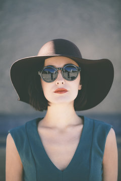trendy young woman wearing hat