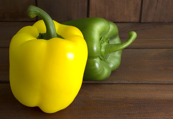 Juicy beautiful Bulgarian pepper on a wooden background