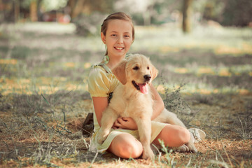 Retriever pup Lovely scene cute young teen girl enjoying posing summer time vacation with best friend dog ivory white labrador puppy.Happy airily careless childhood life world of dreams with puppies
