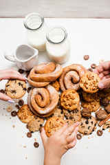 Healthy breakfast with pastry products, close up top view. Family taking wholegrain scones from...