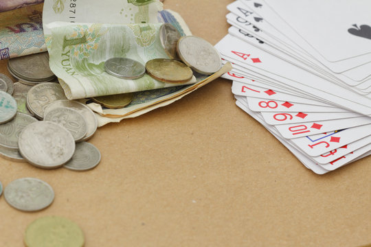 Playing cards and money on the table. Copy space and background.