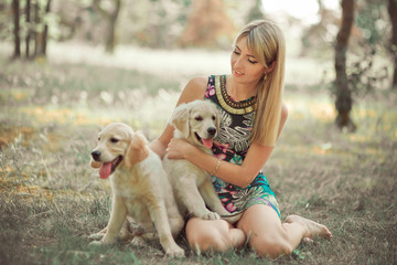 Retriever pup Lovely scene beautifull blond lady woman enjoy posing summer time vacation with best friend dog ivory white labrador puppy.Happy airily careless life world of dreams with puppies.