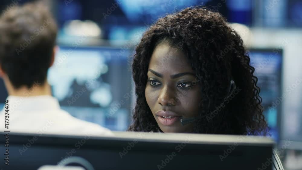 Poster female customer service representative answer client's questions in a headset. he works for a big te