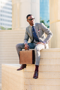 Man in a suit holding a briefcase