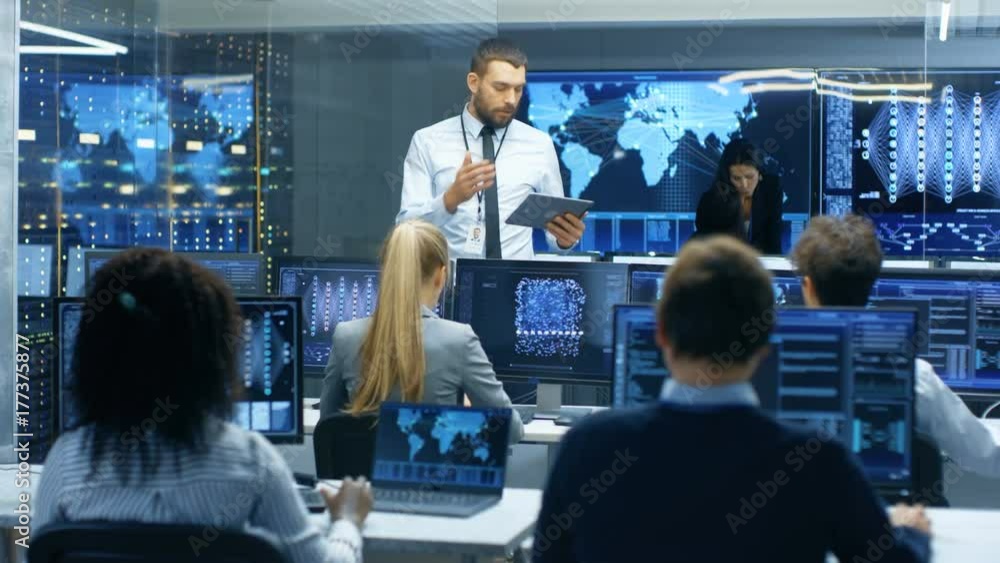 Poster Chief Project Engineer Holds Briefing for a Team of Scientists that are Building Machine Learning System. Displays Show Working Model of Neural Network. 