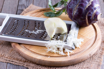 Grated kohlrabi on a wooden table