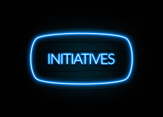 Initiatives  - colorful Neon Sign on brickwall