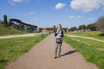 Obraz premium A happy woman is walking around Rome, Italy 