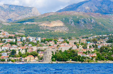 Fototapeta premium View of resort town of Herceg Novi and fortress of Forte Mare from sea, Montenegro