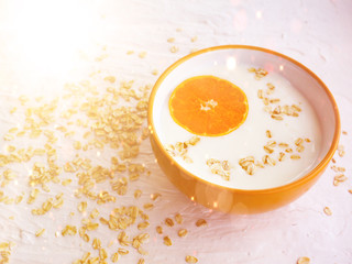Oatmeal porridge on milk with Mandarin and kiwi