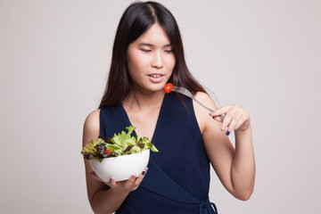 Healthy Asian woman with salad.