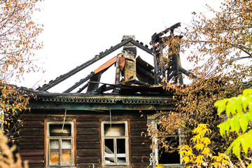 Burnt traditional Russian wooden house (izba) in autumn. Gorokhovets, Vladimir oblast, Russia