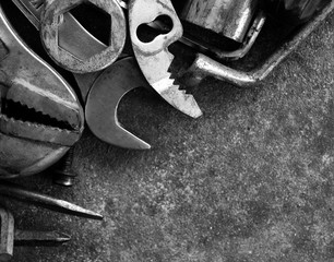 many tool on cement ground in black and white photography
