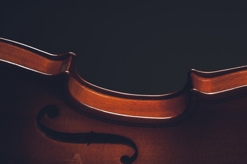 Violin musical instruments of orchestra closeup on black