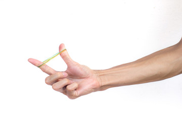 A man hand holding elastic rubber band on white background. Rubber band used to tie the goods. Or...
